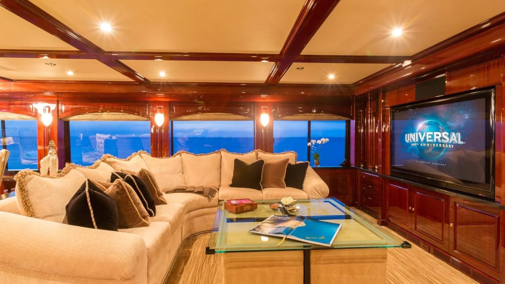 a living room with a large television aboard LADY ELAINE Yacht for Charter