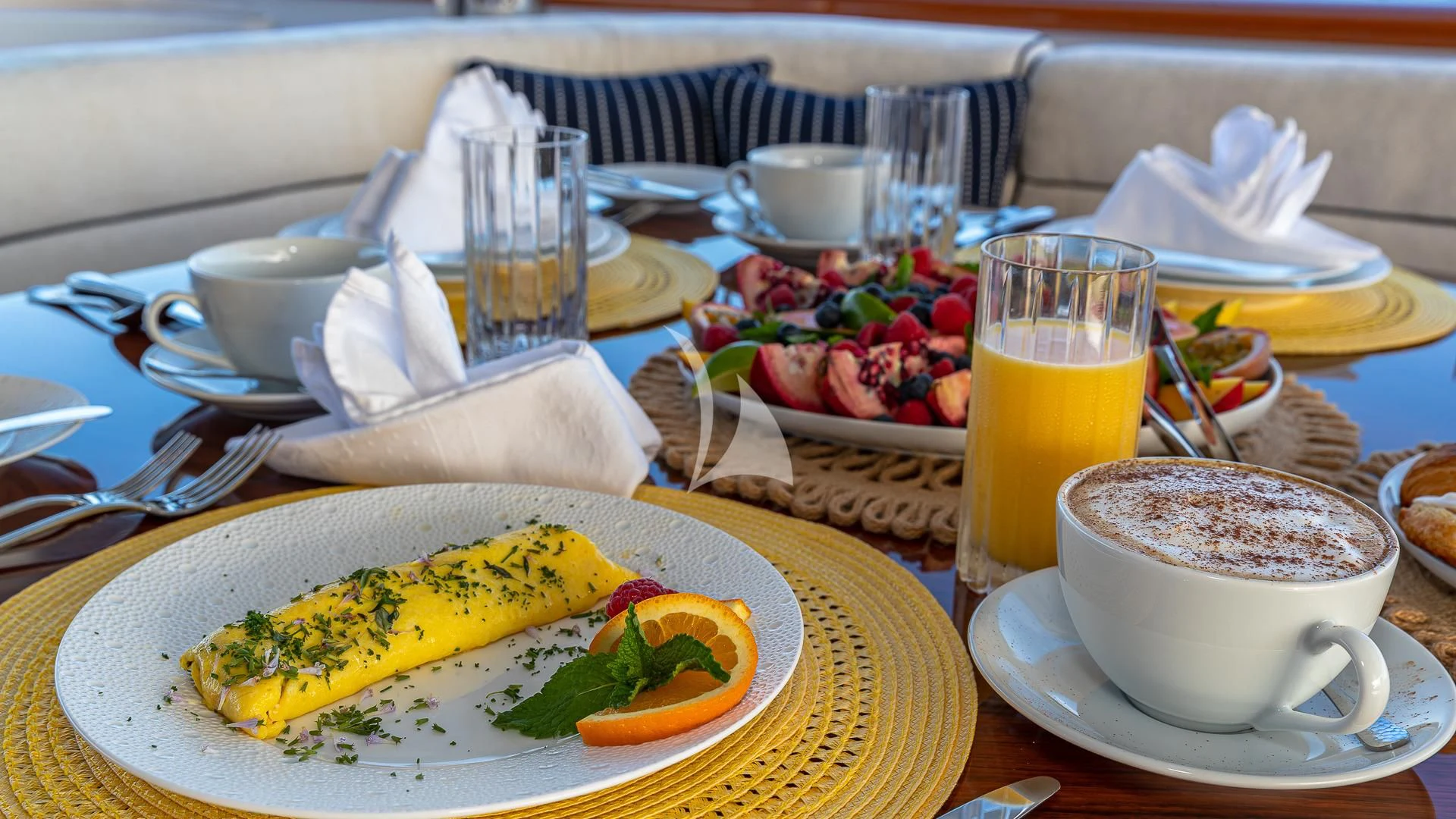 a banana on a plate with a cup of coffee and a plate of food aboard LADY ELAINE Yacht for Charter