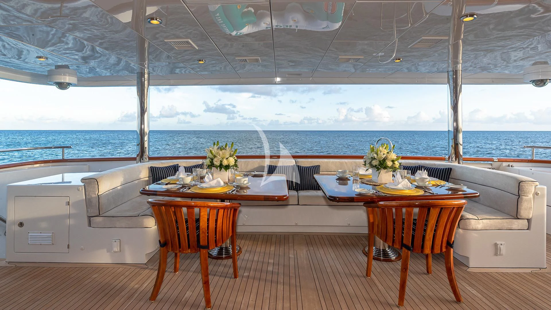 a room with a table and chairs aboard LADY ELAINE Yacht for Charter