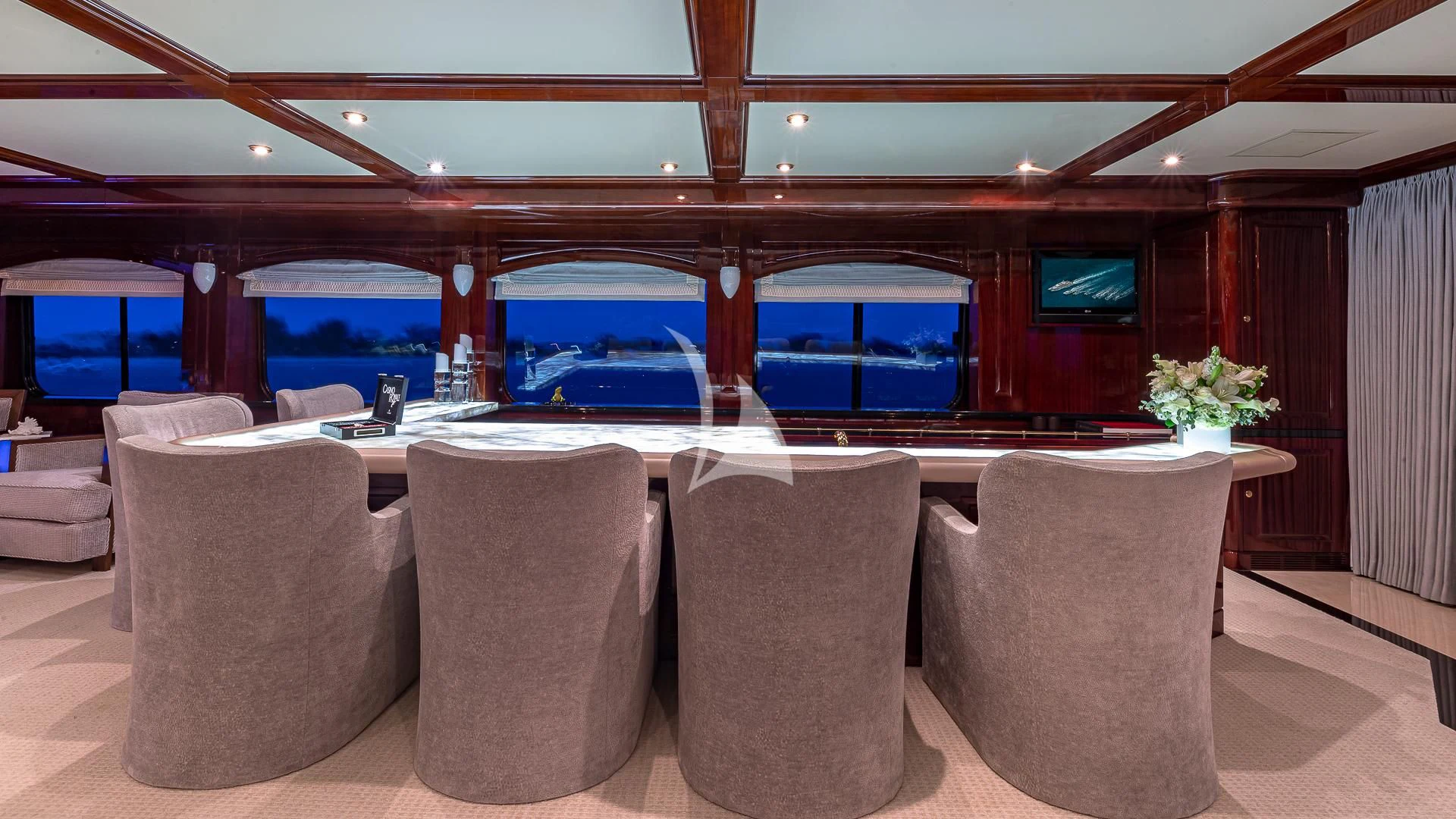 a room with a table and chairs aboard LADY ELAINE Yacht for Charter
