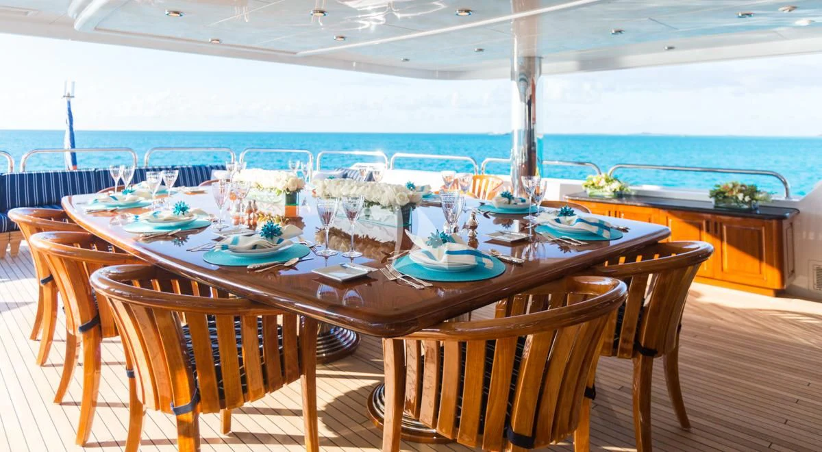 a table set for a dinner party aboard LADY ELAINE Yacht for Charter