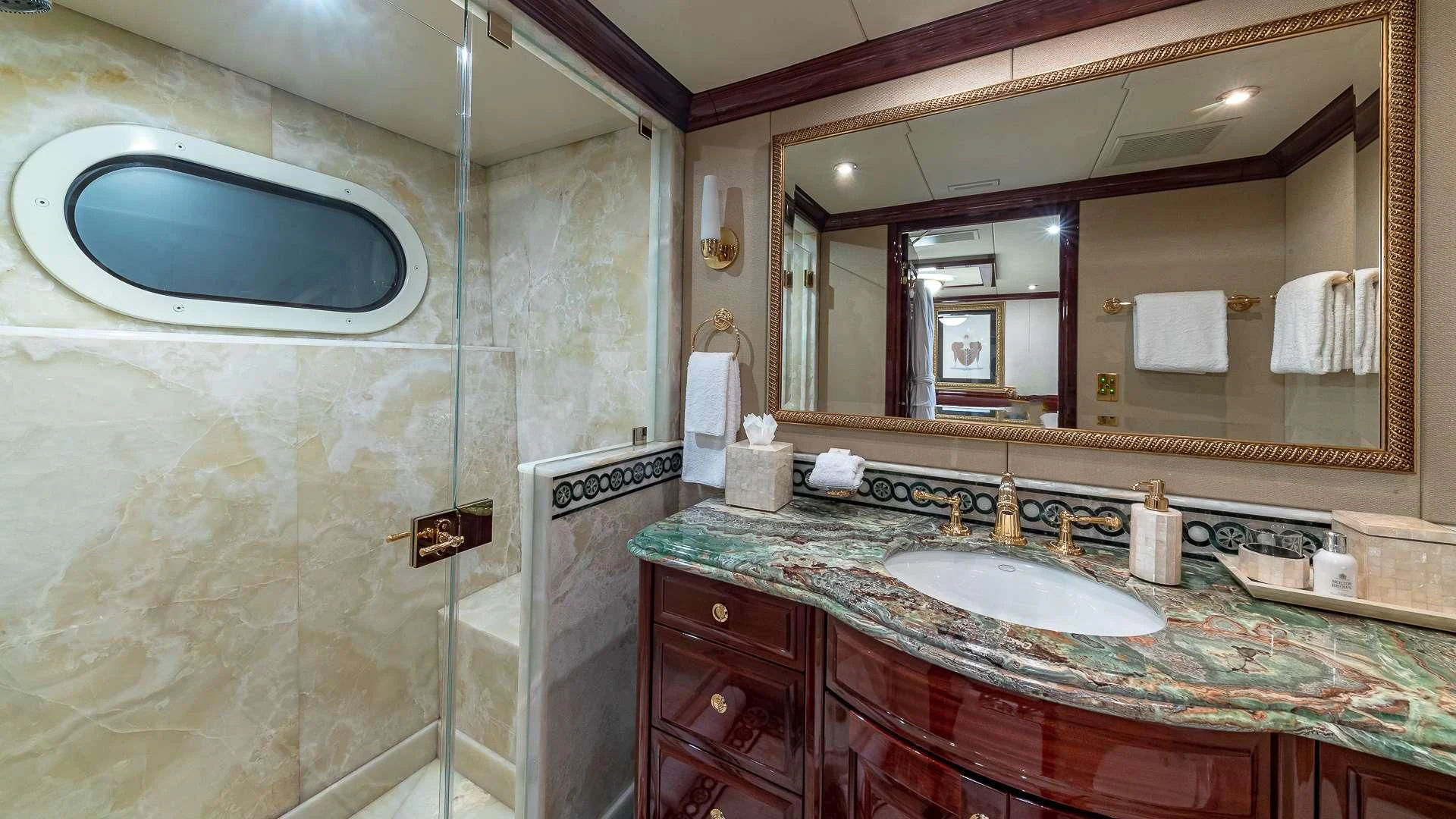 a bathroom with a large mirror aboard LADY ELAINE Yacht for Charter