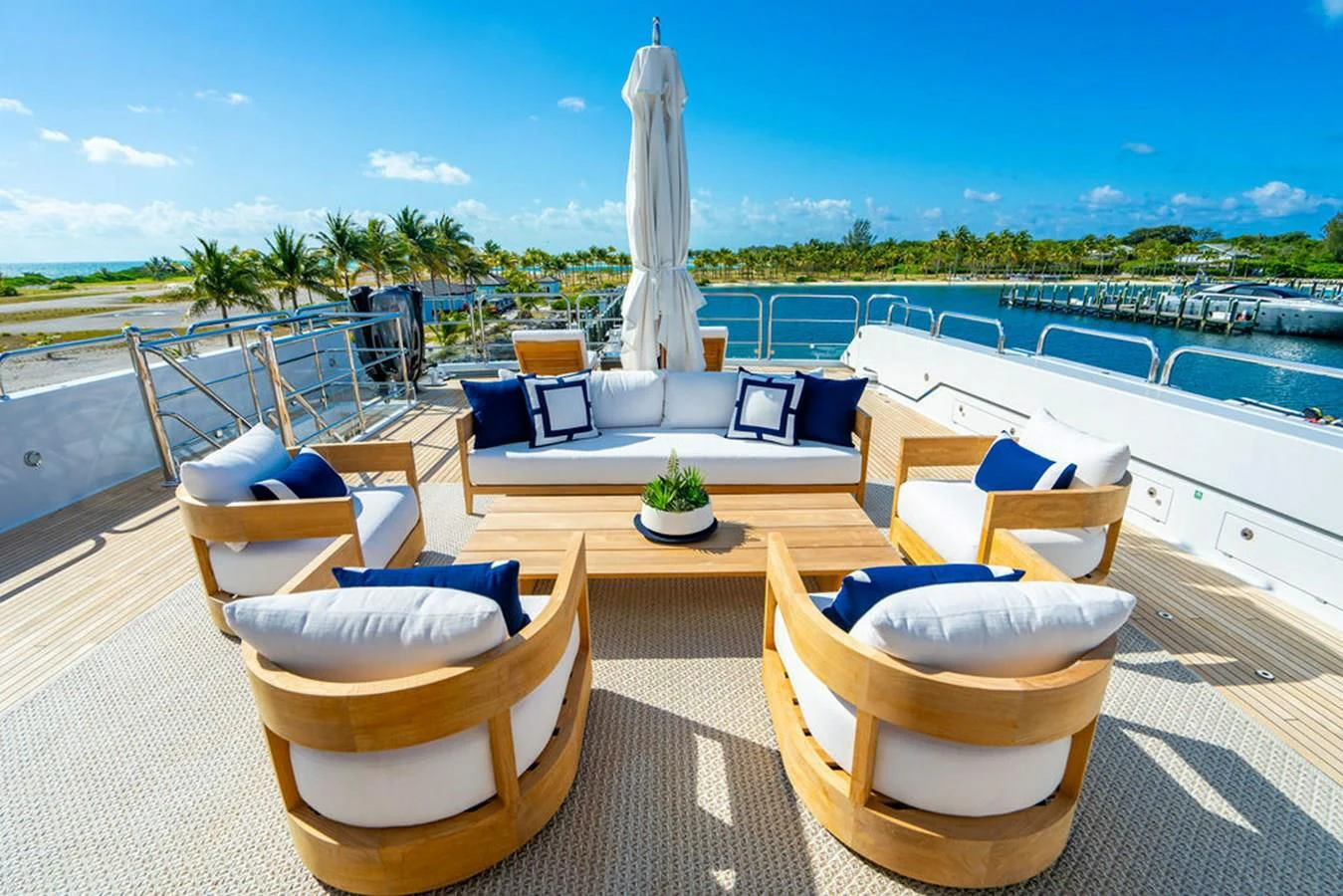 a patio with a pool and a patio with chairs and a fountain aboard LADY ELAINE Yacht for Charter