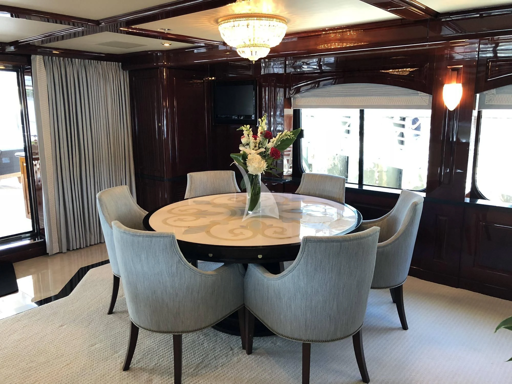 a dining room with a table and chairs aboard LADY ELAINE Yacht for Charter