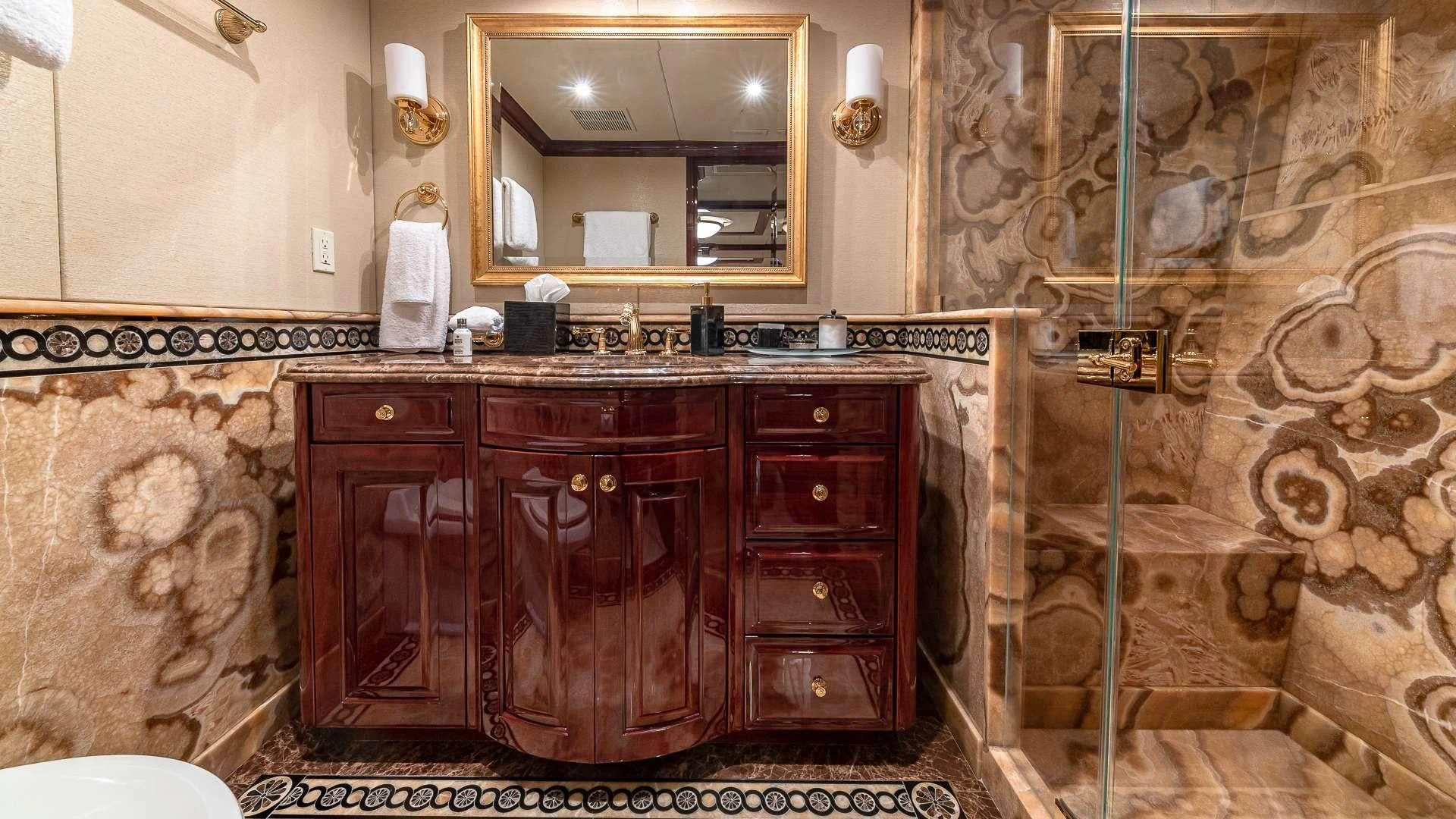 a bathroom with marble tiles aboard LADY ELAINE Yacht for Charter