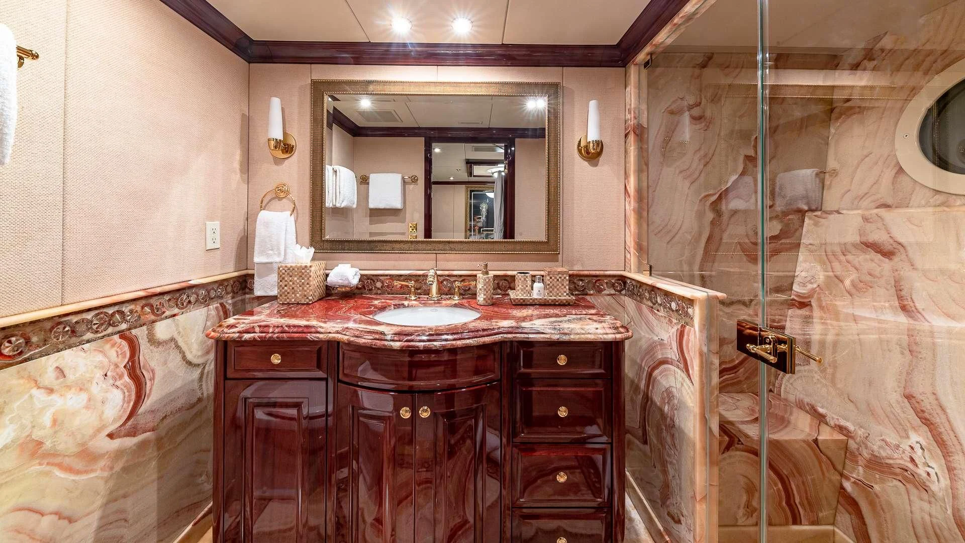 a bathroom with a sink and a mirror aboard LADY ELAINE Yacht for Charter