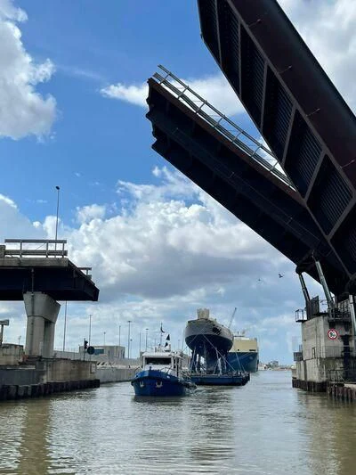 a bridge over water with boats aboard SAKARA Yacht for Sale