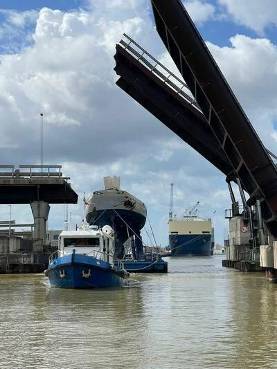 a boat under a bridge aboard SAKARA Yacht for Sale