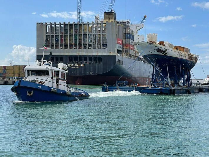 a large ship in the water aboard SAKARA Yacht for Sale