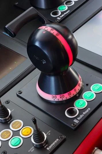 a pink and black gas mask on a car dashboard aboard PRIMERO Yacht for Sale