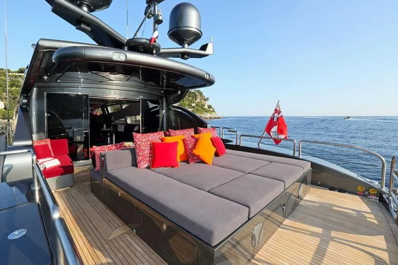 a boat with a flag on the front aboard PRIMERO Yacht for Sale