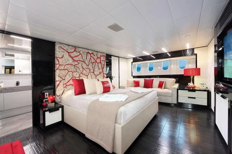 a room with a bed and a tv aboard PRIMERO Yacht for Sale