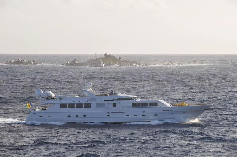 a seagull flying over a boat in the water aboard JAVA Yacht for Sale