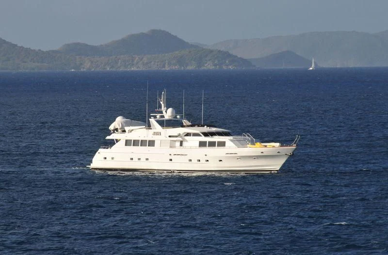 a white boat in the water aboard JAVA Yacht for Sale