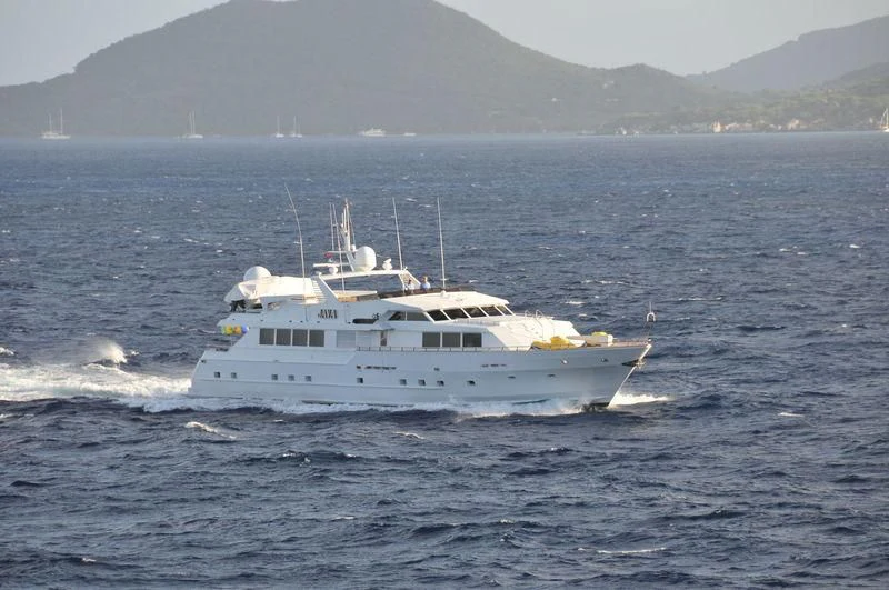a white boat in the water aboard JAVA Yacht for Sale