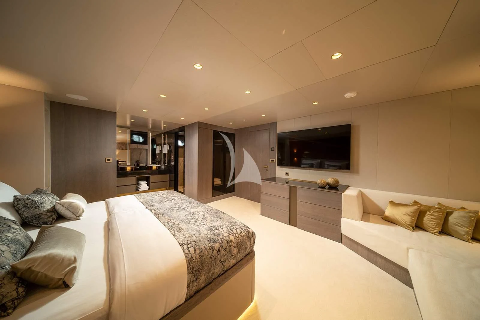 a bedroom with a bed and a couch aboard NOCTURNO Yacht for Sale