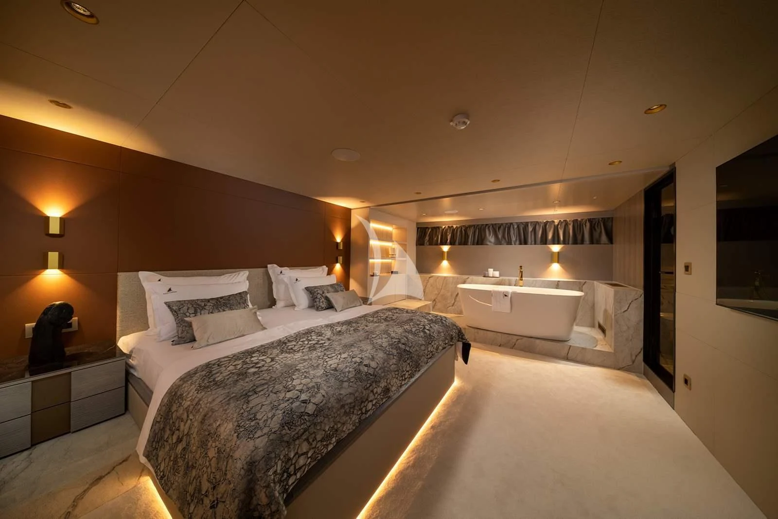 a large hotel room with a large bed and a large mirror aboard NOCTURNO Yacht for Sale