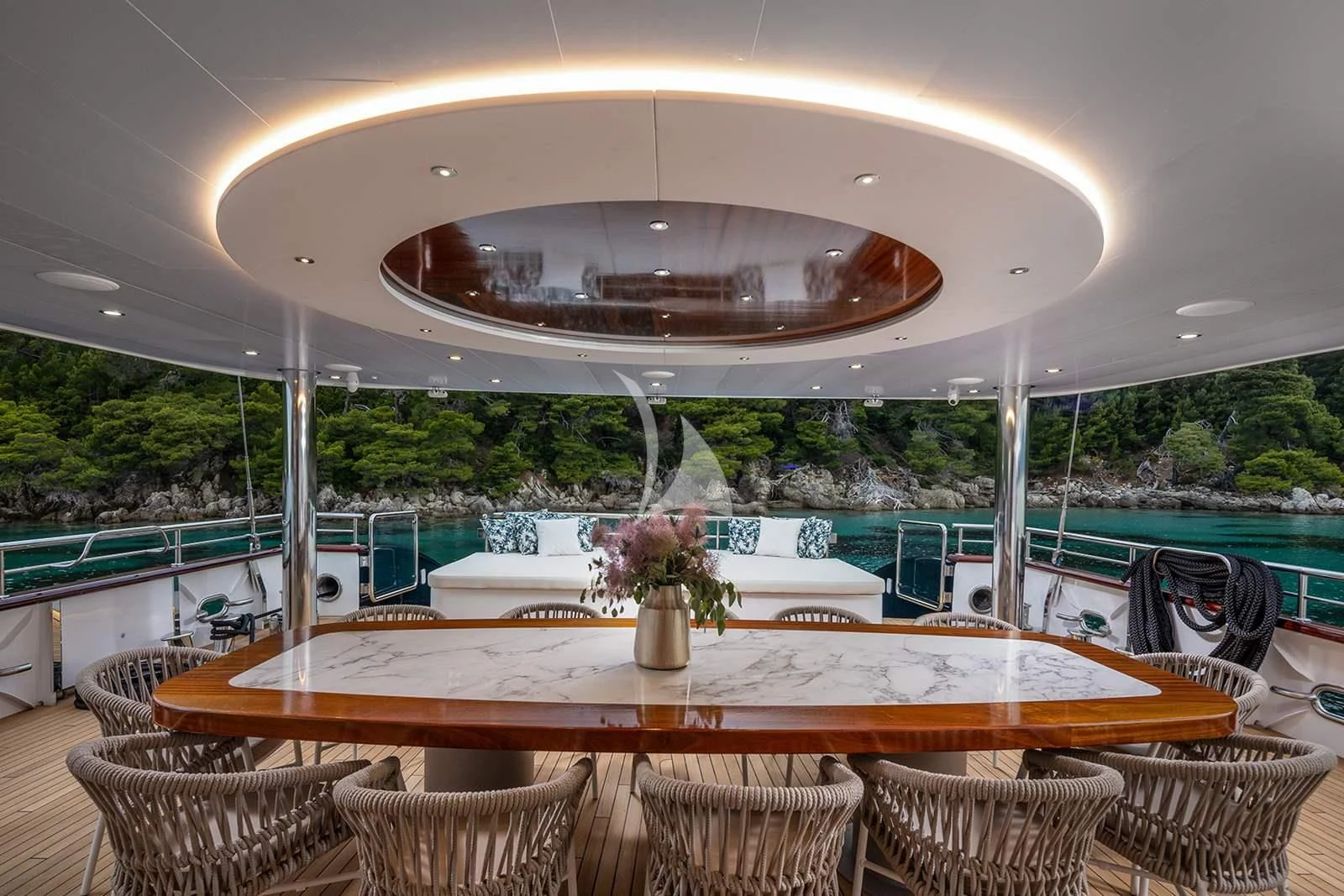 a large round table with chairs and a large round white table with a large round white table with aboard NOCTURNO Yacht for Sale