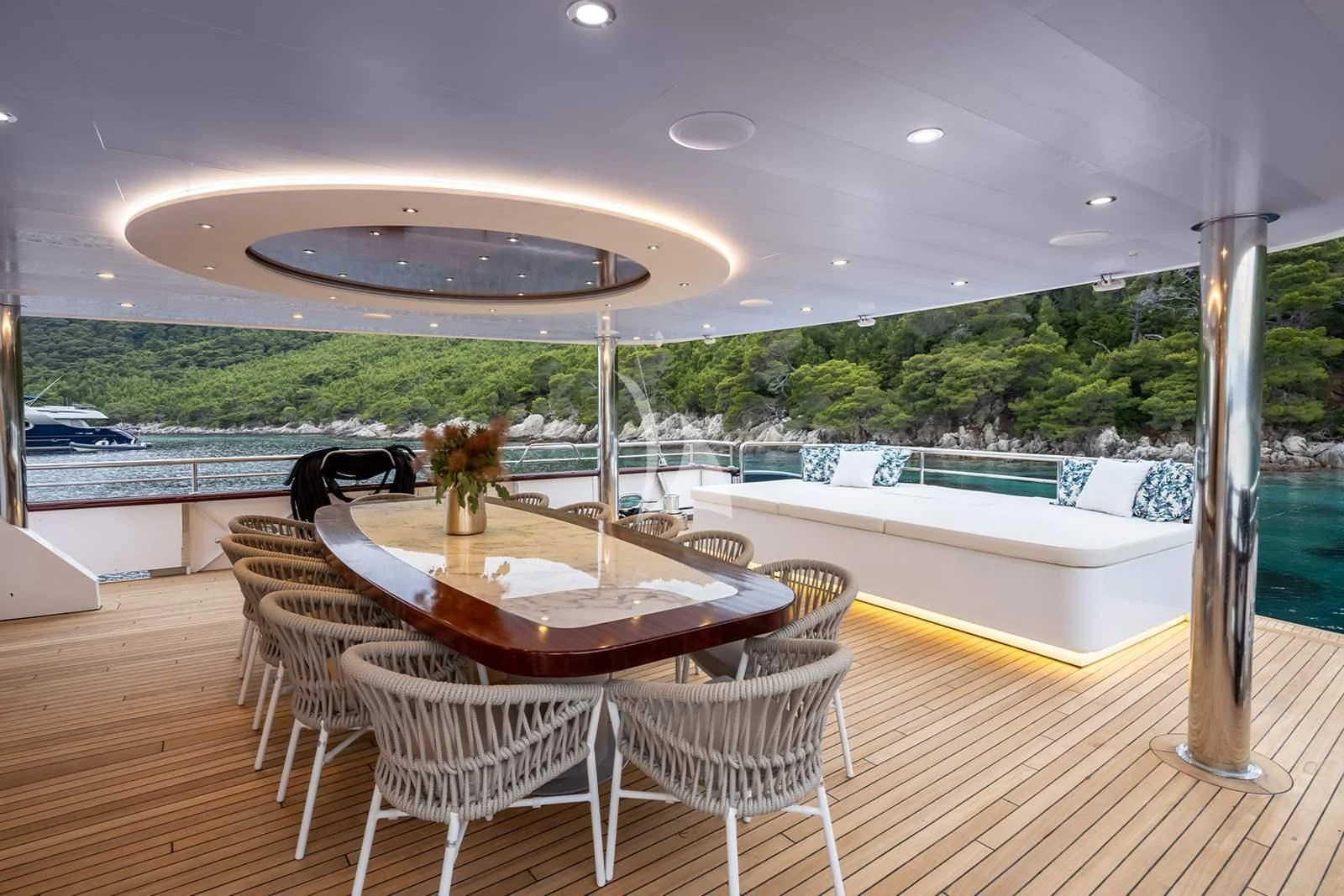 a table and chairs on a deck aboard NOCTURNO Yacht for Sale