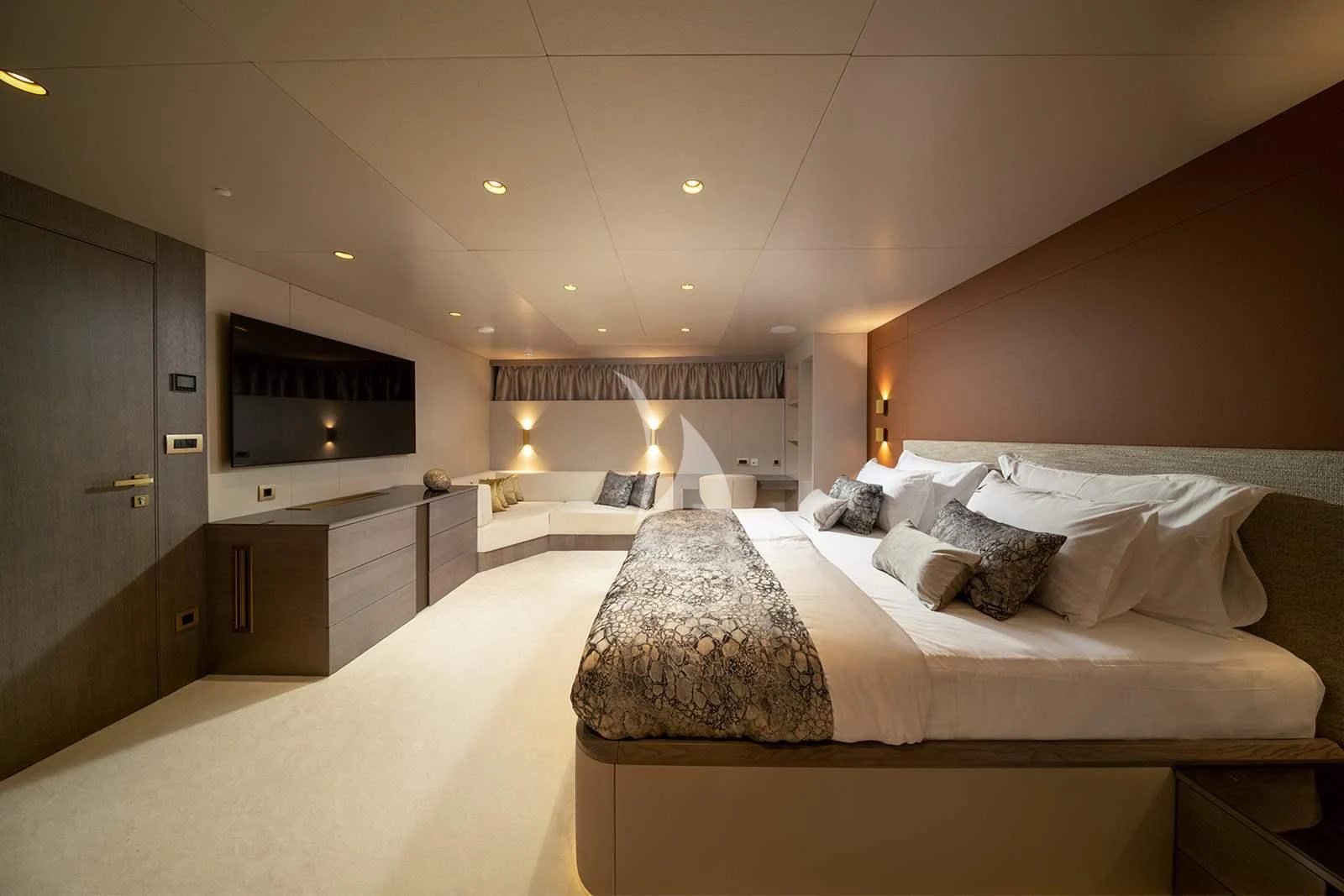 a room with a bed and a television aboard NOCTURNO Yacht for Sale