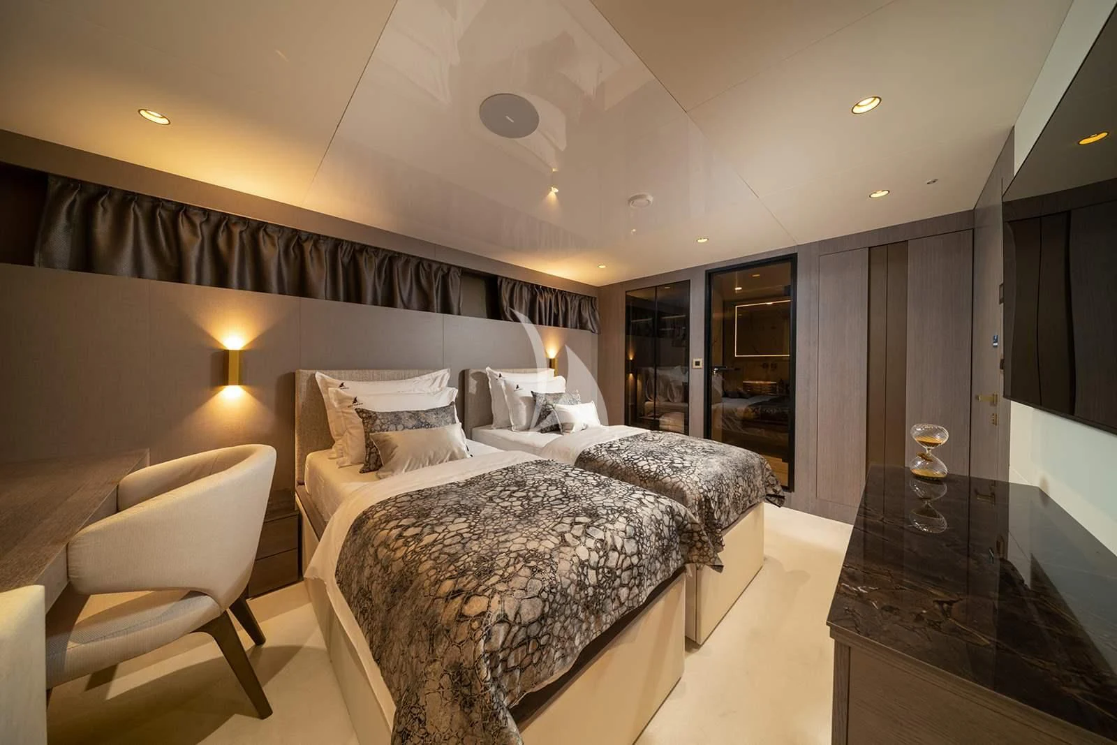 a hotel room with a bed and a chair aboard NOCTURNO Yacht for Sale