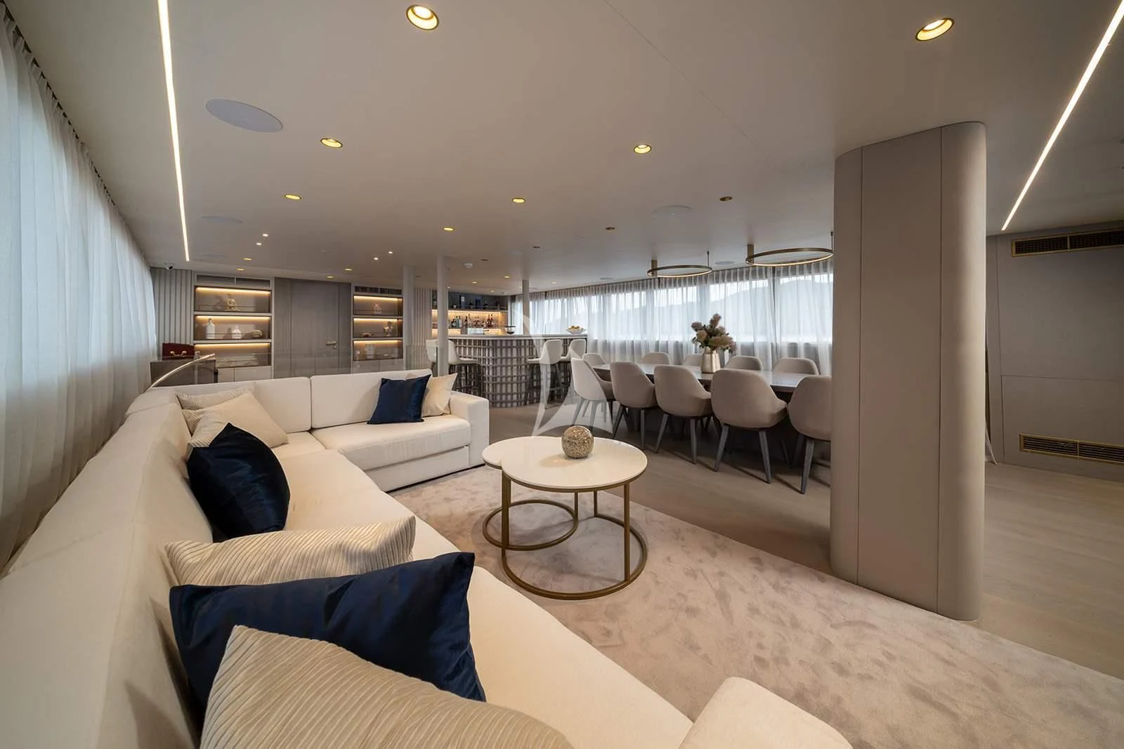 a large living room with a large window aboard NOCTURNO Yacht for Sale