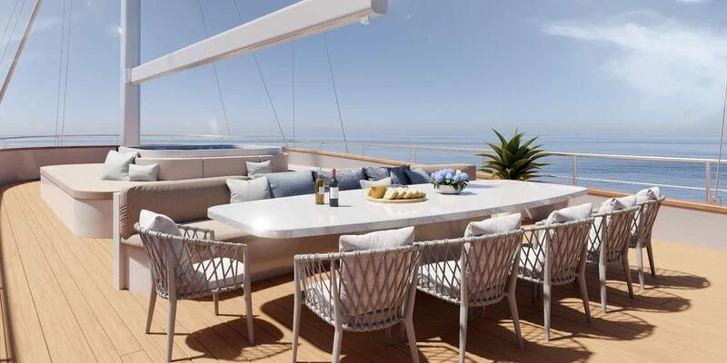 a table and chairs on a deck aboard NOCTURNO Yacht for Sale