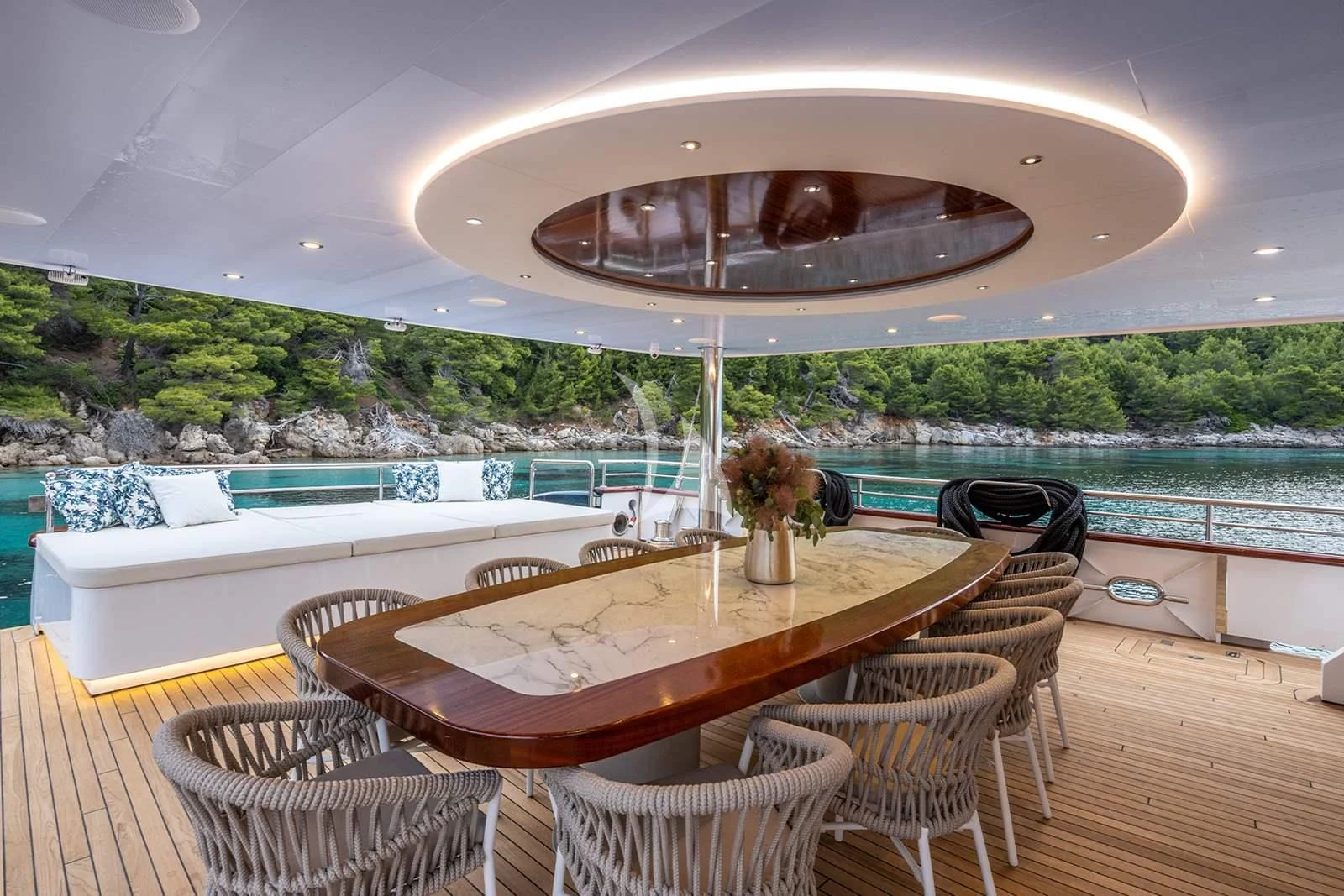 a table and chairs on a deck aboard NOCTURNO Yacht for Sale
