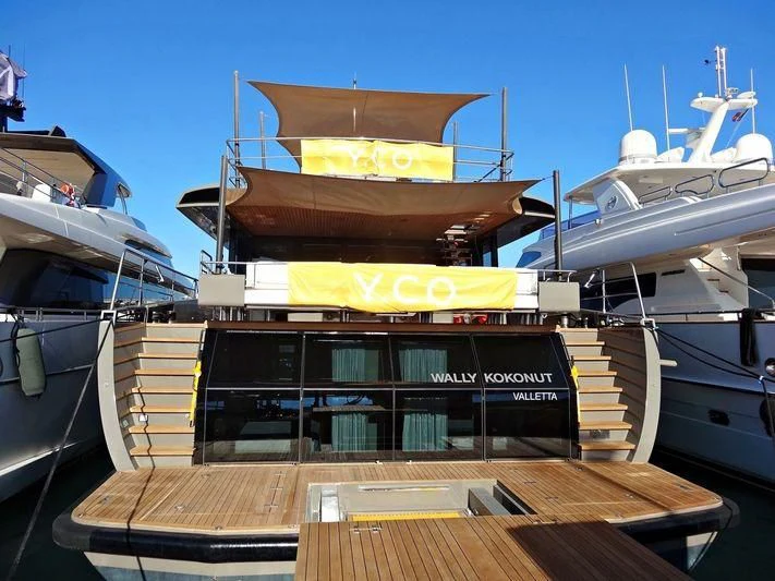 a boat with a yellow sign aboard KOKONUT'S WALLY Yacht for Sale