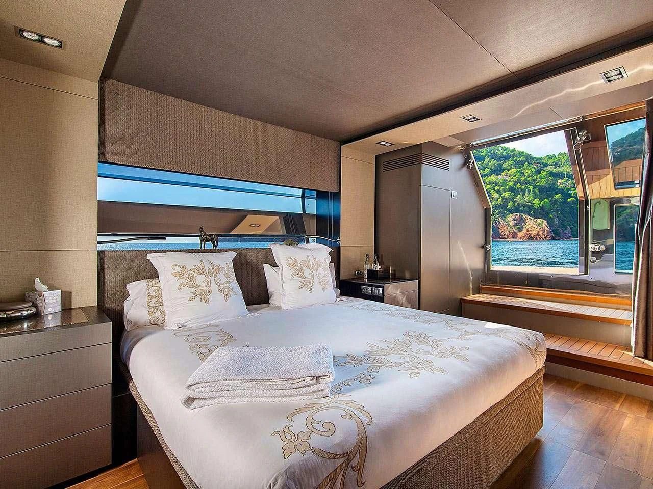 a bed in a room aboard KOKONUT'S WALLY Yacht for Sale