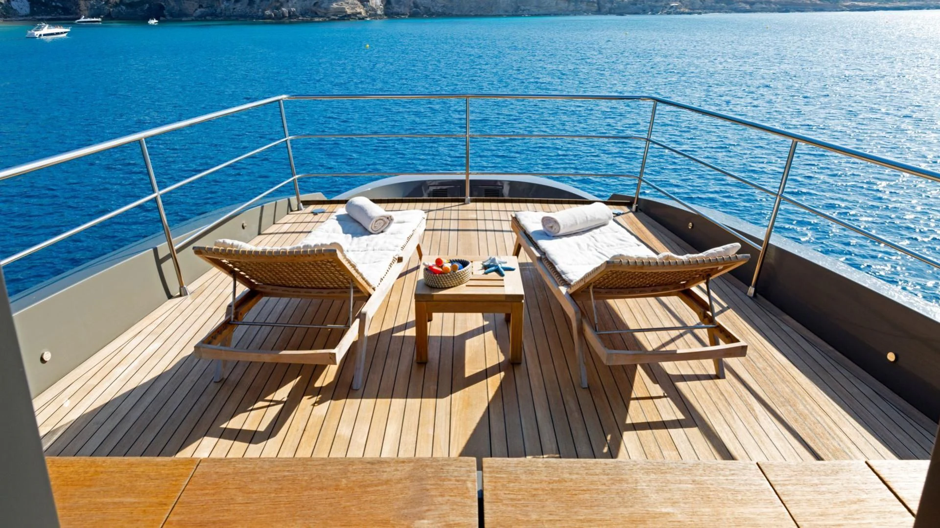 a deck with chairs on it aboard KOKONUT'S WALLY Yacht for Sale