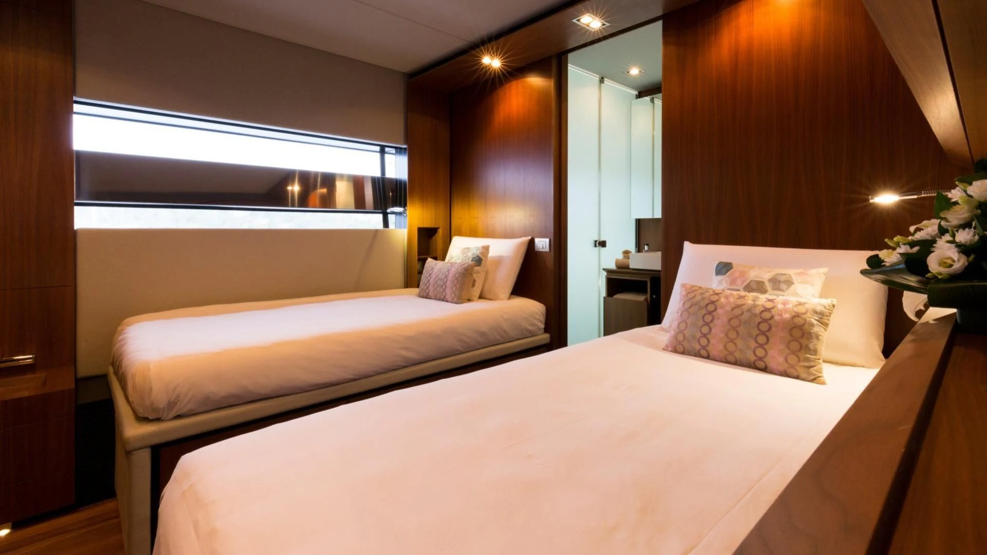 a hotel room with two beds aboard KOKONUT'S WALLY Yacht for Sale