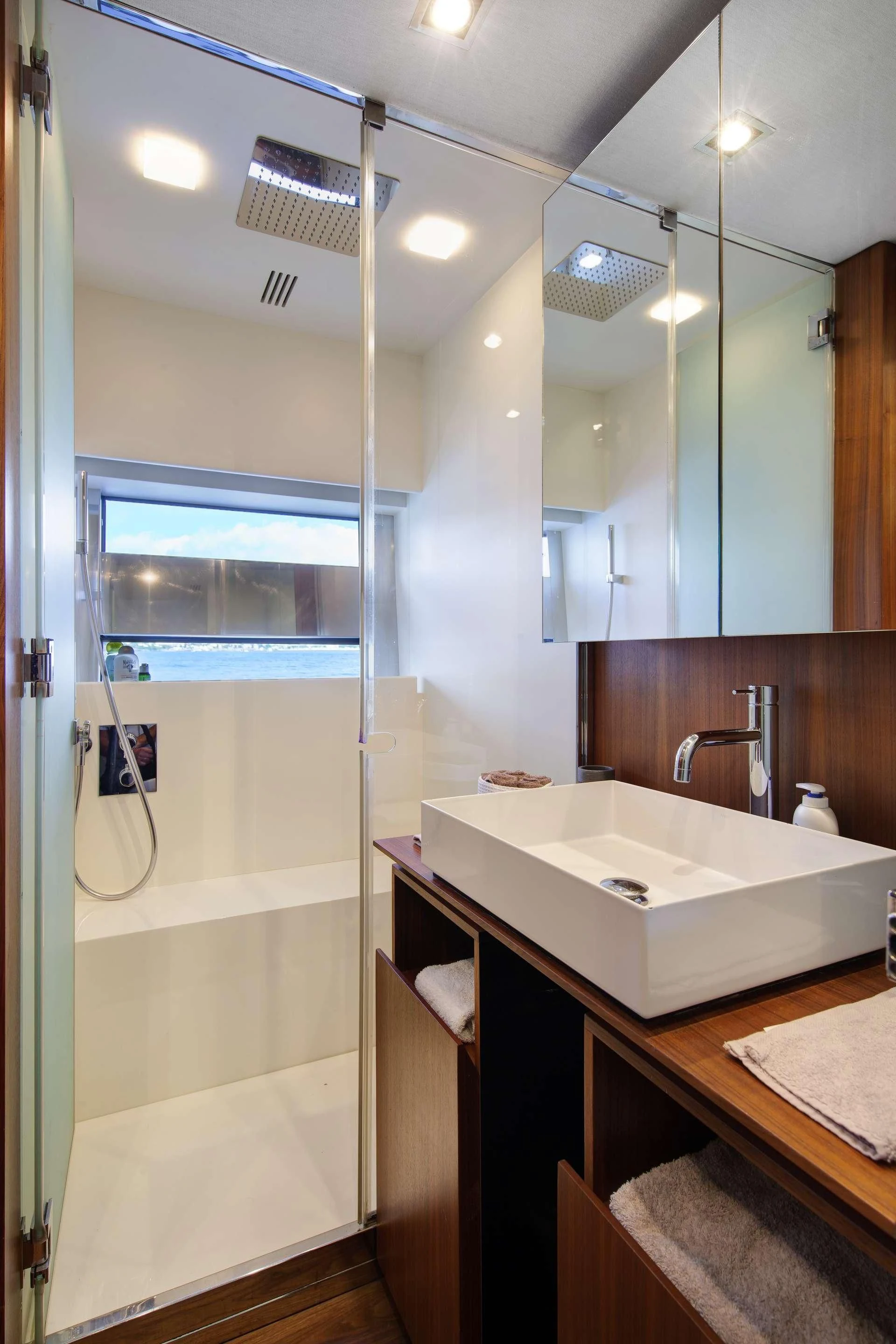 a bathroom with a glass shower aboard KOKONUT'S WALLY Yacht for Sale