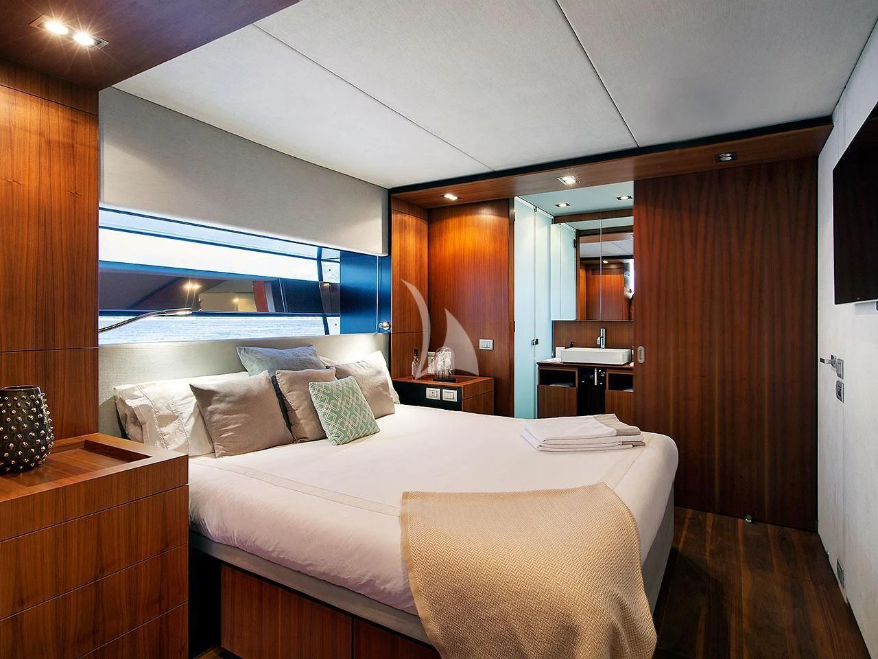 a room with a bed and a window aboard KOKONUT'S WALLY Yacht for Sale
