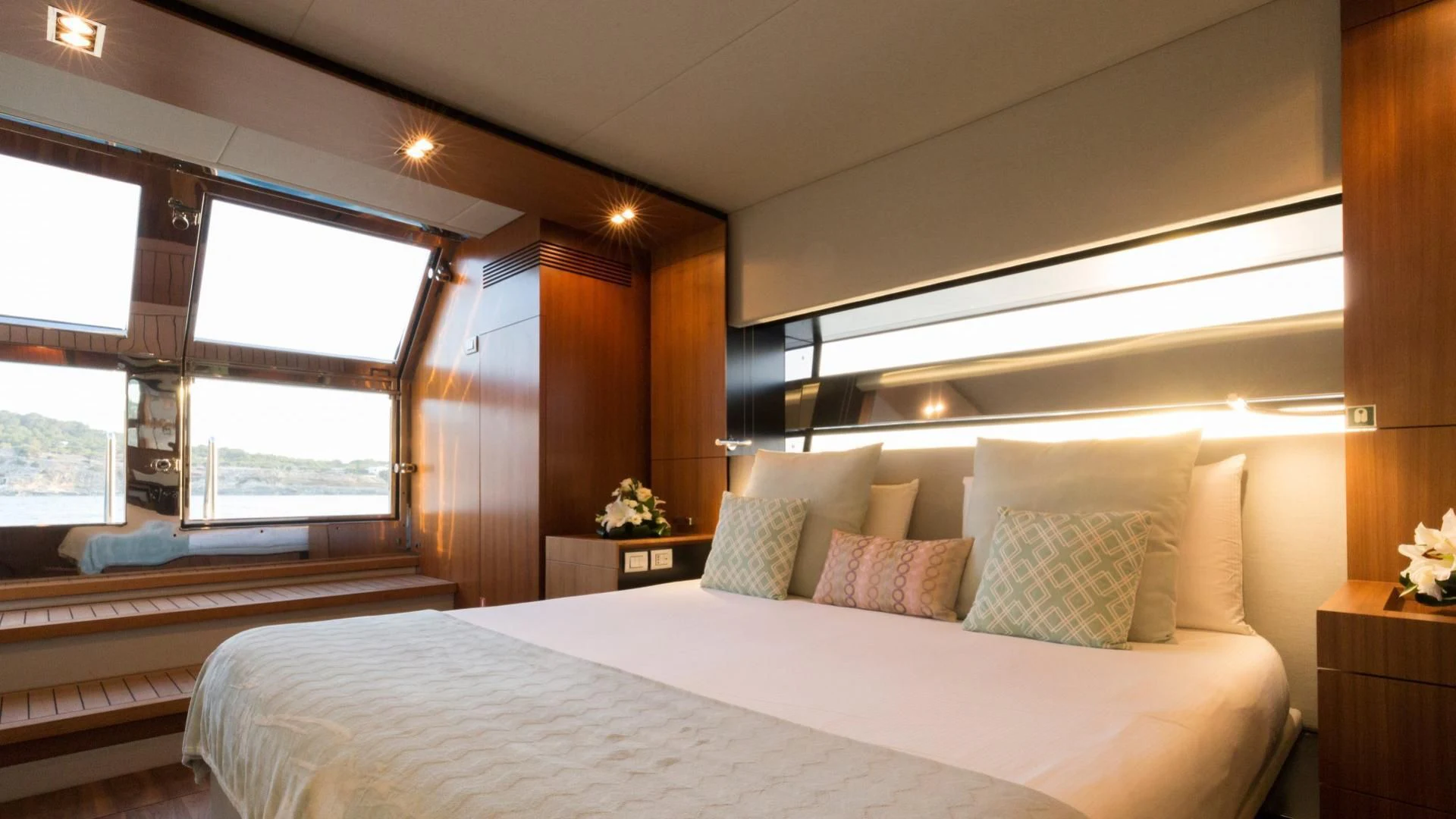 a room with a bed and a window aboard KOKONUT'S WALLY Yacht for Sale
