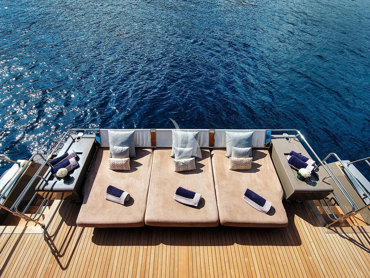 a deck with chairs on it aboard KOKONUT'S WALLY Yacht for Sale