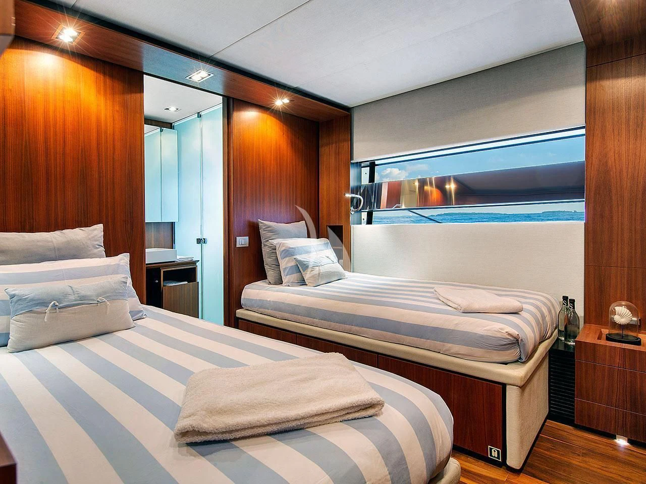 a room with two beds aboard KOKONUT'S WALLY Yacht for Sale