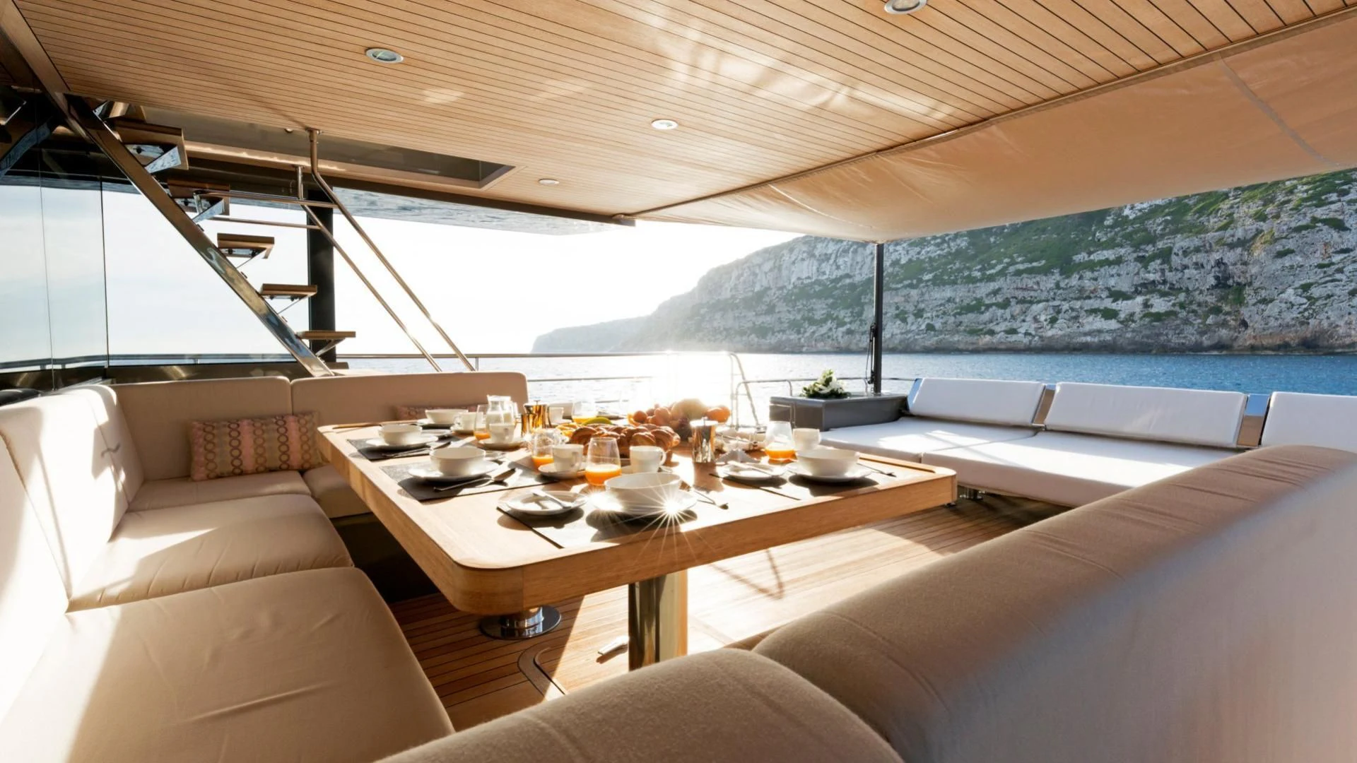 a room with a table and chairs aboard KOKONUT'S WALLY Yacht for Sale
