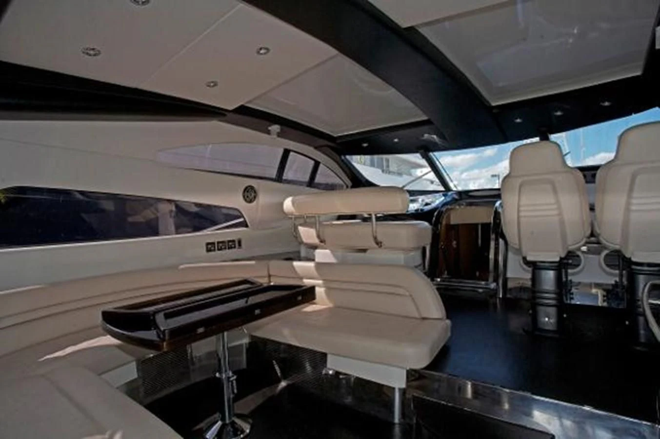 a room with a table and chairs aboard H2 Yacht for Sale