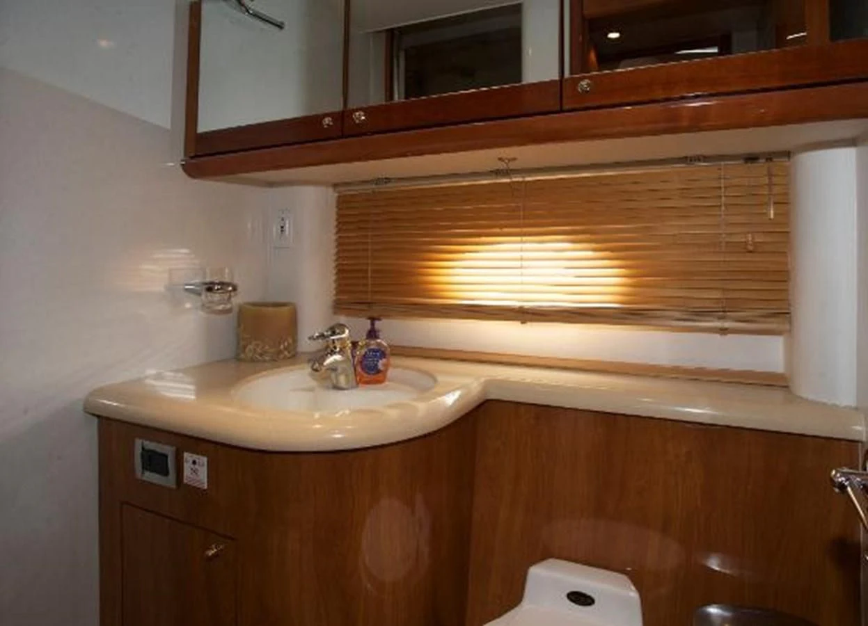 a bathroom with a sink and a mirror aboard H2 Yacht for Sale