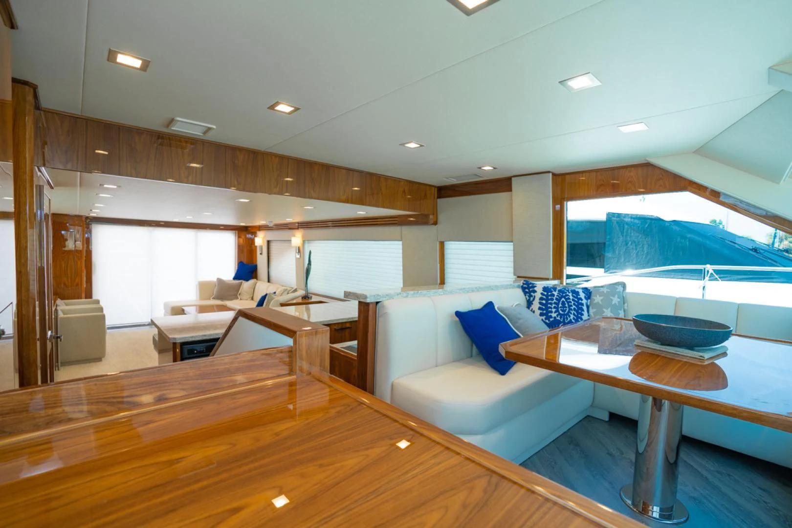 a large living room with a pool aboard MAKE IT HAPPEN Yacht for Sale