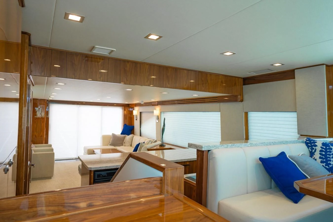 a living room with a wood floor aboard MAKE IT HAPPEN Yacht for Sale