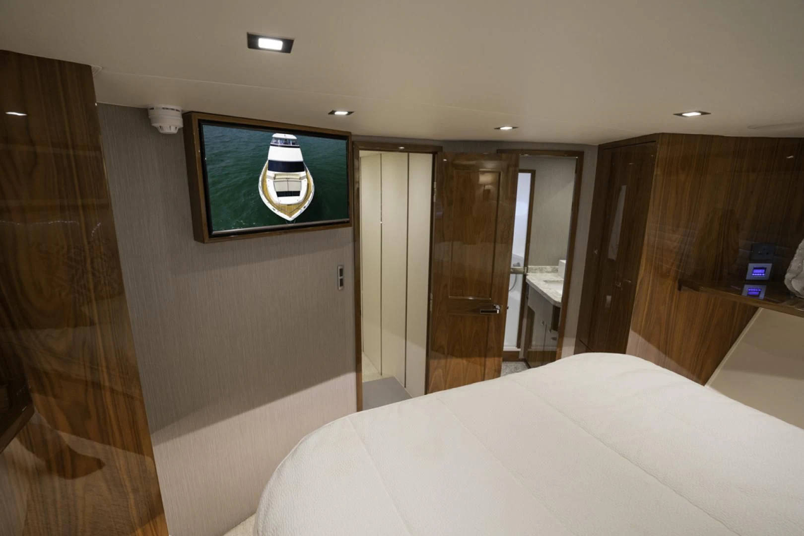 a hotel room with a bed and a television aboard MAKE IT HAPPEN Yacht for Sale