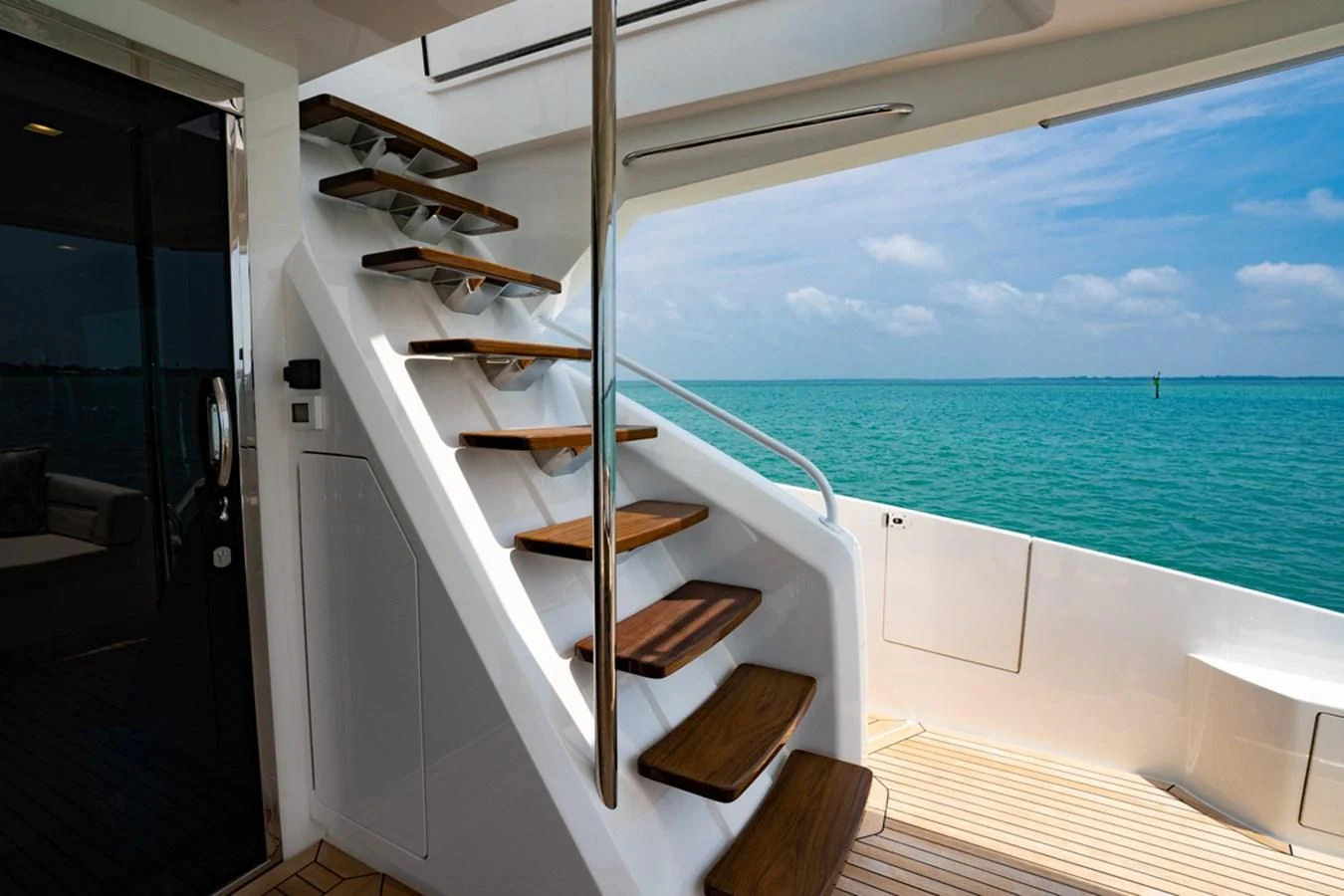 a wooden staircase leading to a beach aboard MAKE IT HAPPEN Yacht for Sale