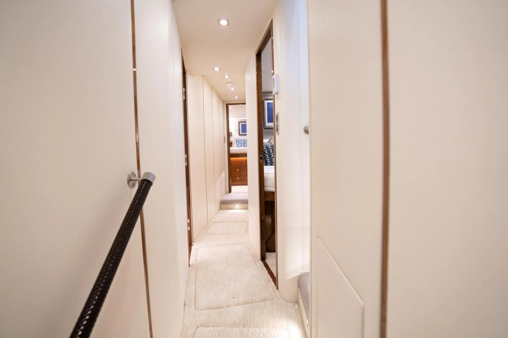 a hallway with white walls aboard MAKE IT HAPPEN Yacht for Sale