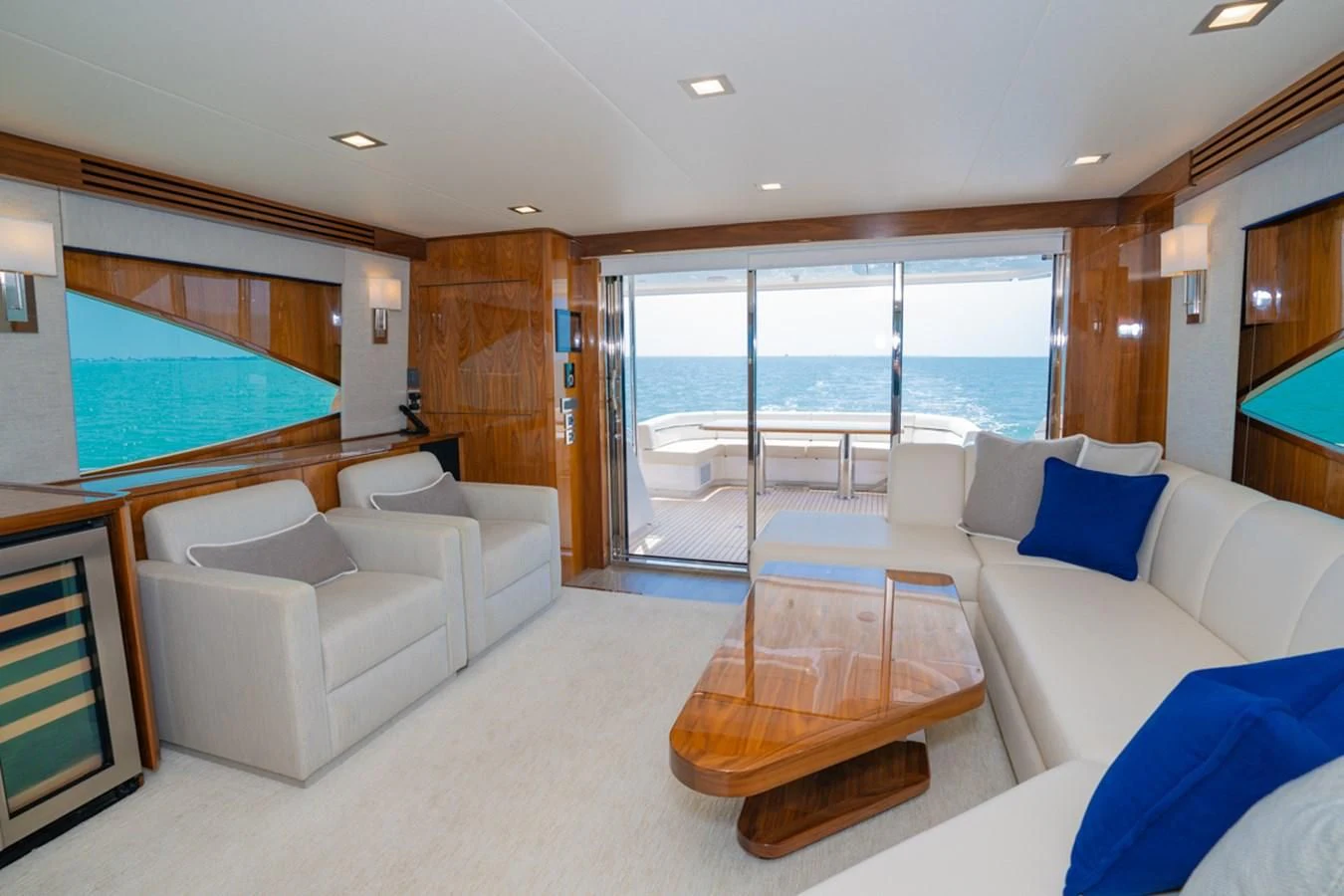 a living room with a large window aboard MAKE IT HAPPEN Yacht for Sale