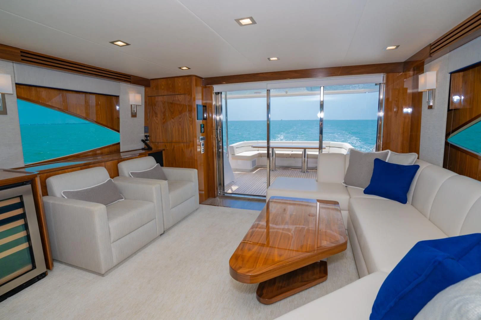 a living room with a large glass window aboard MAKE IT HAPPEN Yacht for Sale