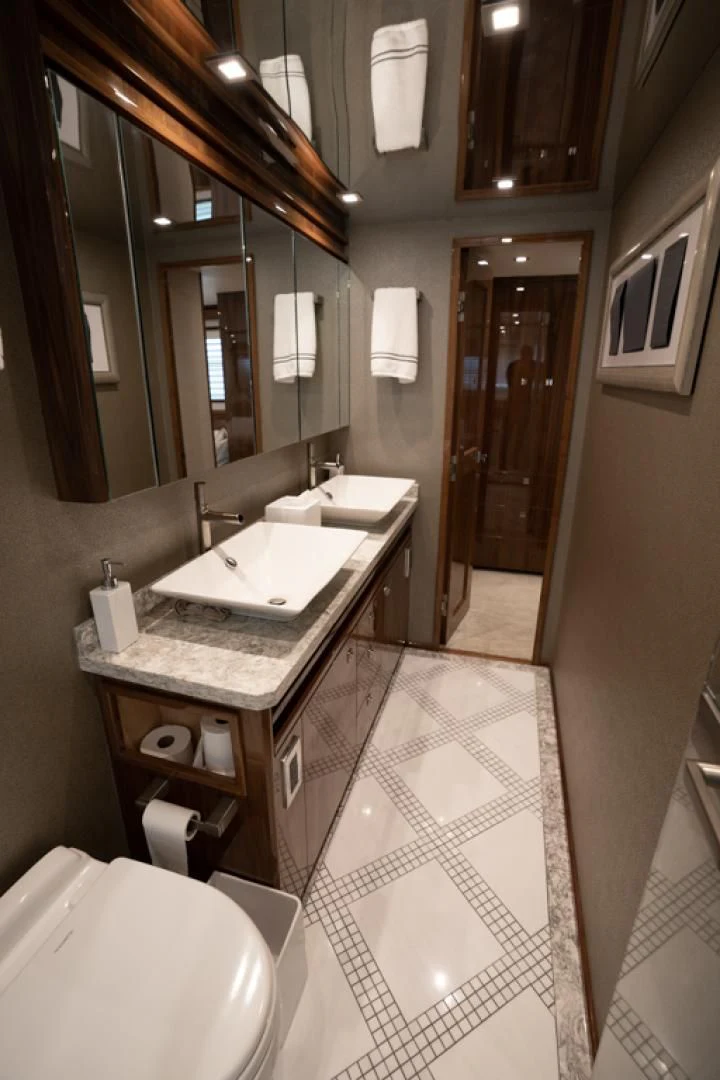 a bathroom with a large mirror aboard MAKE IT HAPPEN Yacht for Sale