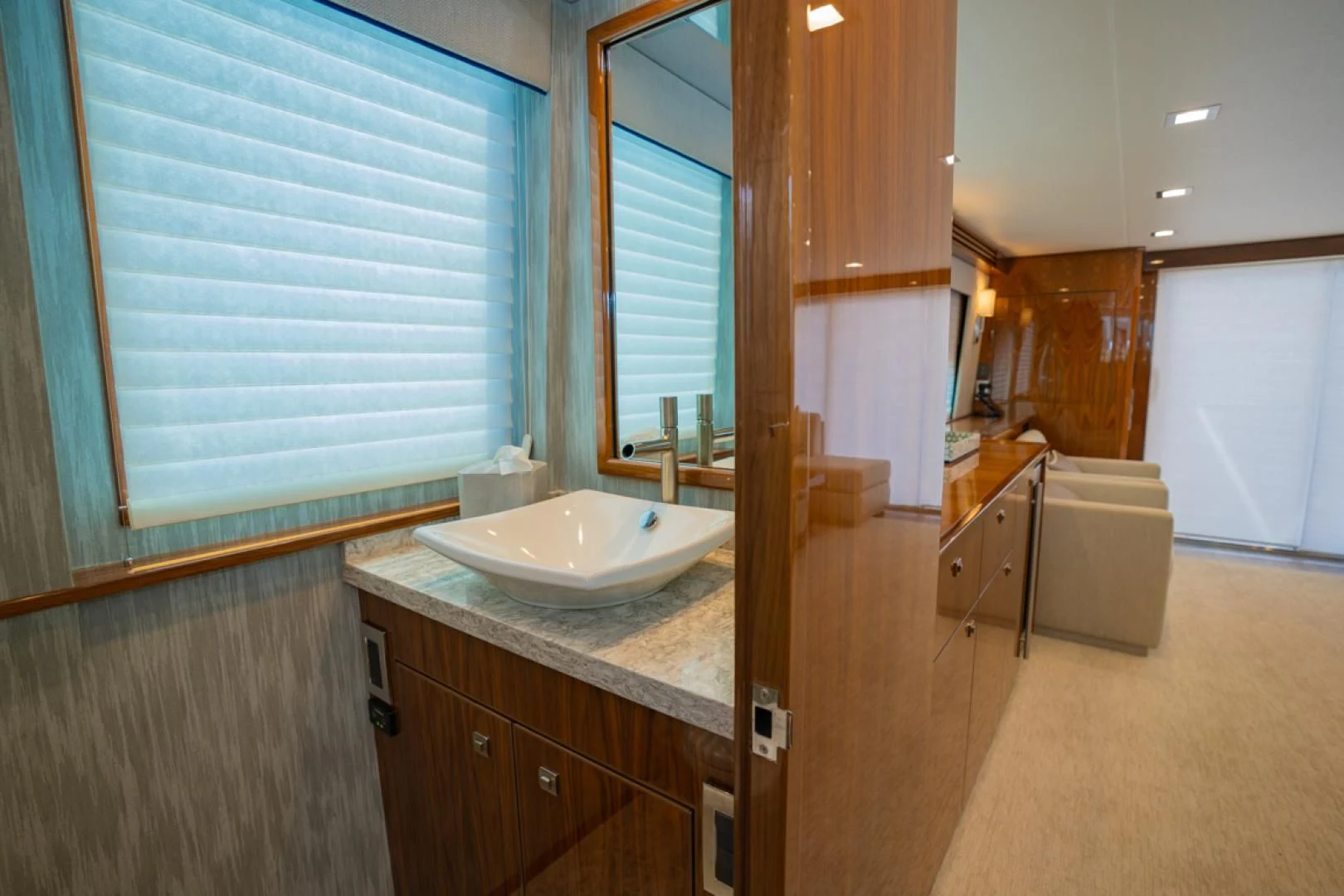 a bathroom with a sink and a window aboard MAKE IT HAPPEN Yacht for Sale
