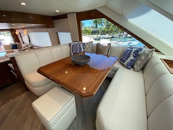 a room with a table and chairs aboard MAKE IT HAPPEN Yacht for Sale
